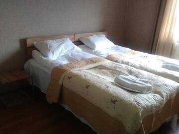 Фото номера Двухместный номер с 2 отдельными кроватями и ванной комнатой Гостевой дом Guest House Maili г. Степанцминда 26