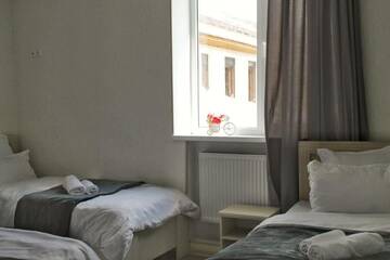 Фото номера Четырехместный номер Отель Hotel NOA Kazbegi г. Степанцминда 4