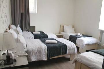 Фото номера Четырехместный номер Отель Hotel NOA Kazbegi г. Степанцминда 5