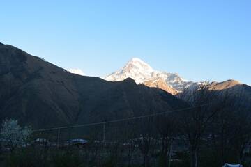 Фото номера Twin Room with Mountain View with Veranda Проживание в семье Ekaterine Guest House г. Степанцминда 25