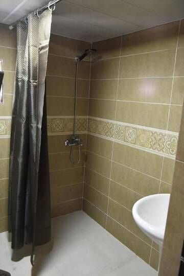 Фото номера Семейный номер с балконом Гостевой дом Wooden Guesthouse г. Степанцминда 23